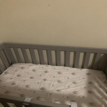 grey baby bed 
